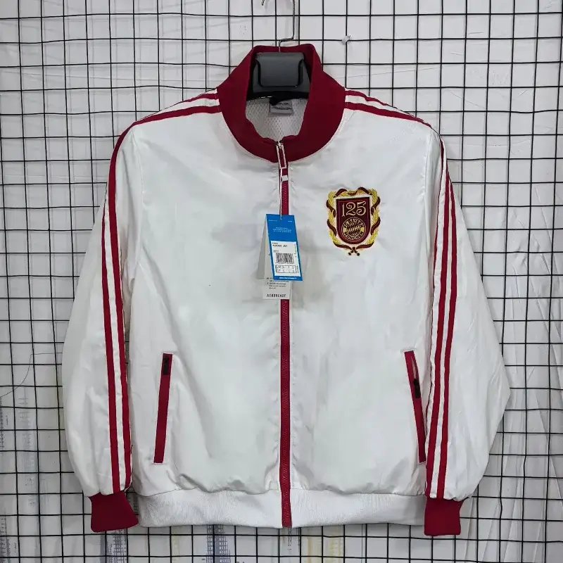 Corteiz White Track Jacket with Red Accents, 125th Anniversary Badge, Zip - Up & Side Pockets