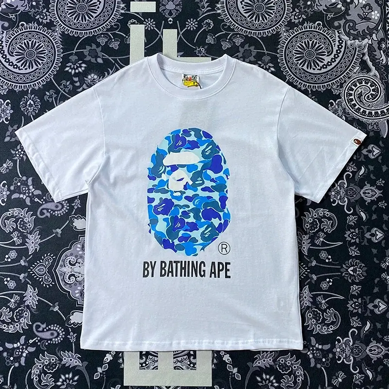 BAPE White T - Shirt with Blue Camouflage Ape Head Graphic and "BY BATHING APE" Text
